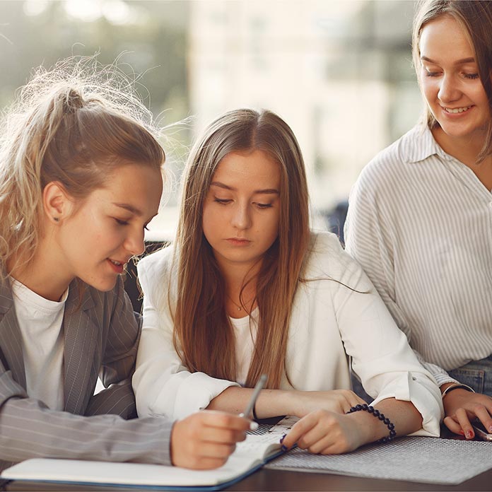 three girls studying